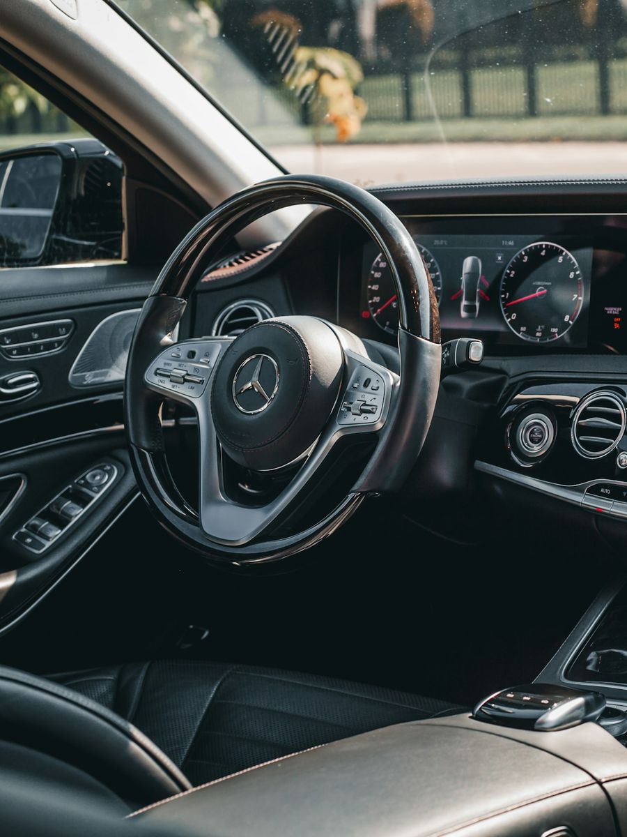 Executive working in the quiet rear cabin of a Mercedes